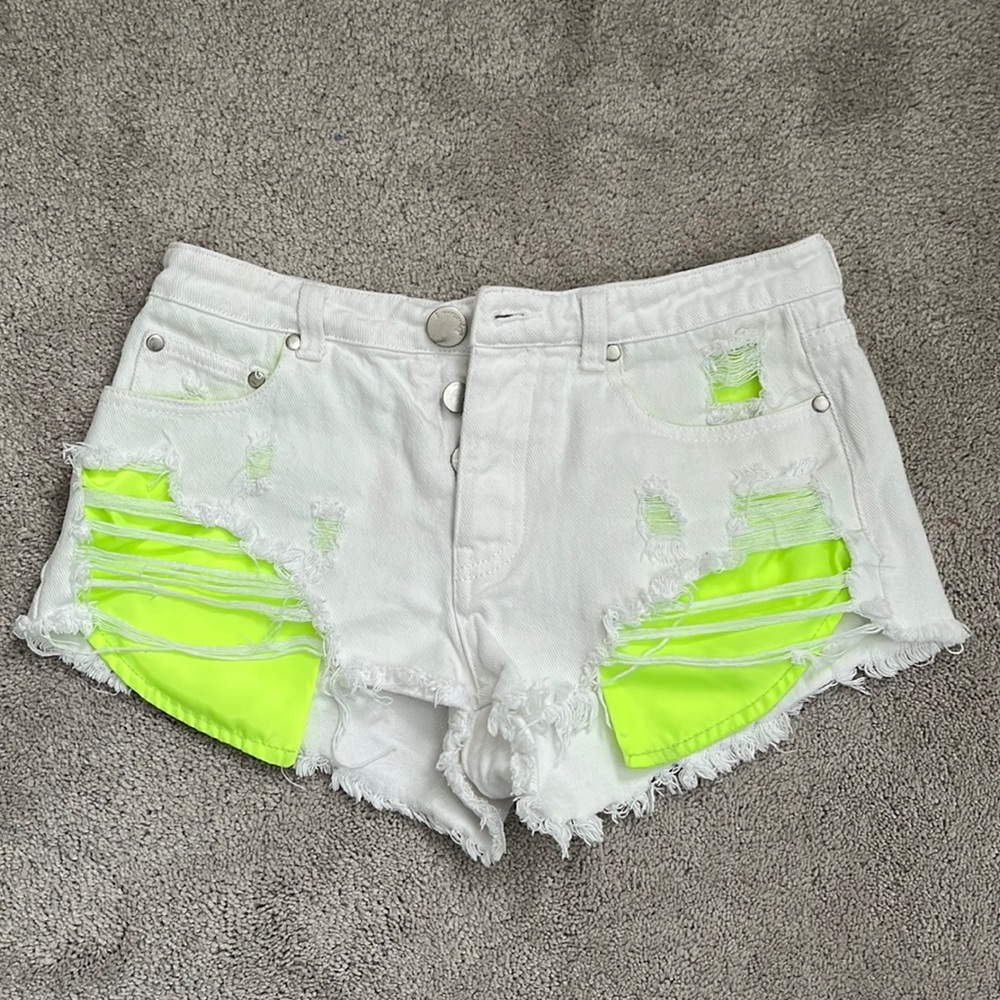White Jean shorts with neon pockets